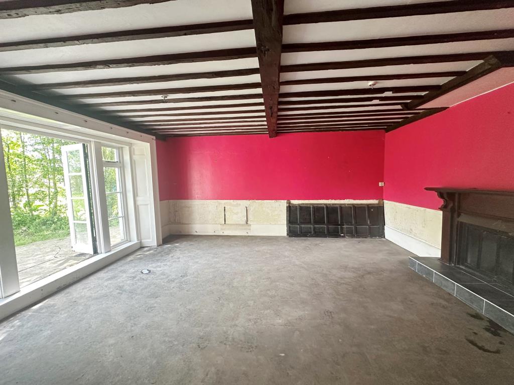 Lot: 98 - SUBSTANTIAL PERIOD HOUSE AND COACH HOUSE ON LARGE PLOT WITH POTENTIAL - Interior room with fire place and access to rear garden